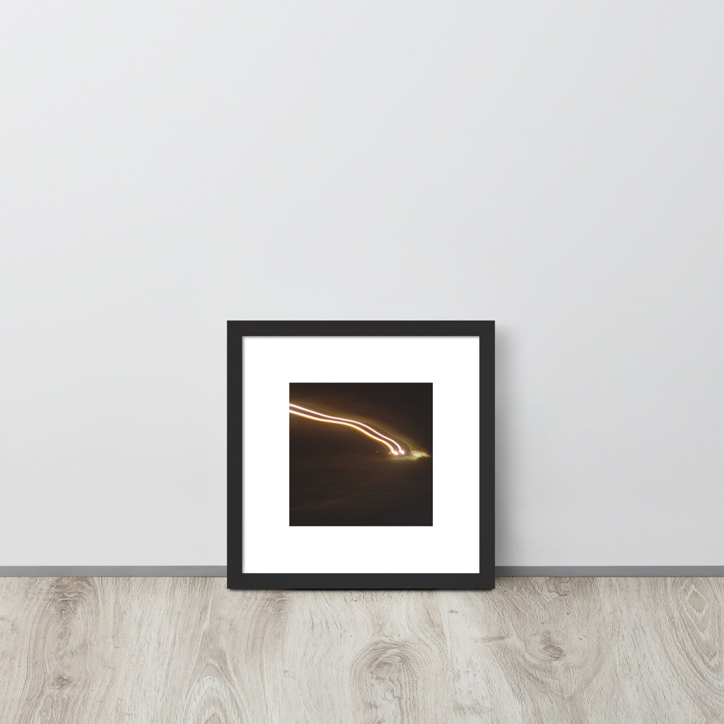 Minimalist streetwear style framed wall art in matte black, featuring a 'Night Car Lights' photograph. / Night Car Lights 額装ポスター（ブラックフレーム）：都会の夜の光の軌跡を捉えたモノクロ写真。モードストリート系ミニマリスト・インテリアアート。