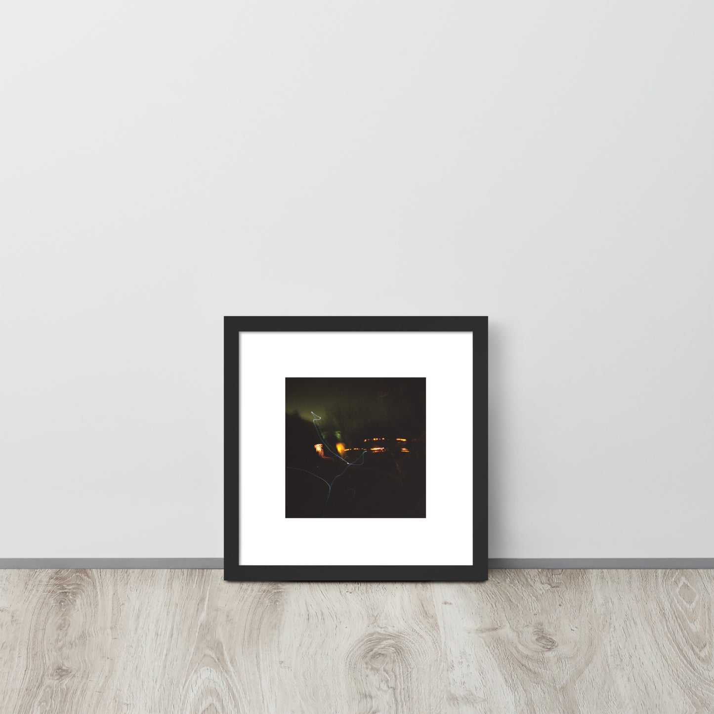 Minimalist streetwear style framed wall art in matte black, featuring a 'Night Light' photograph. / Night Light 額装ポスター（ブラックフレーム）：夜の光の幻想的な風景を捉えた写真。モードストリート系ミニマリスト・インテリアアート。