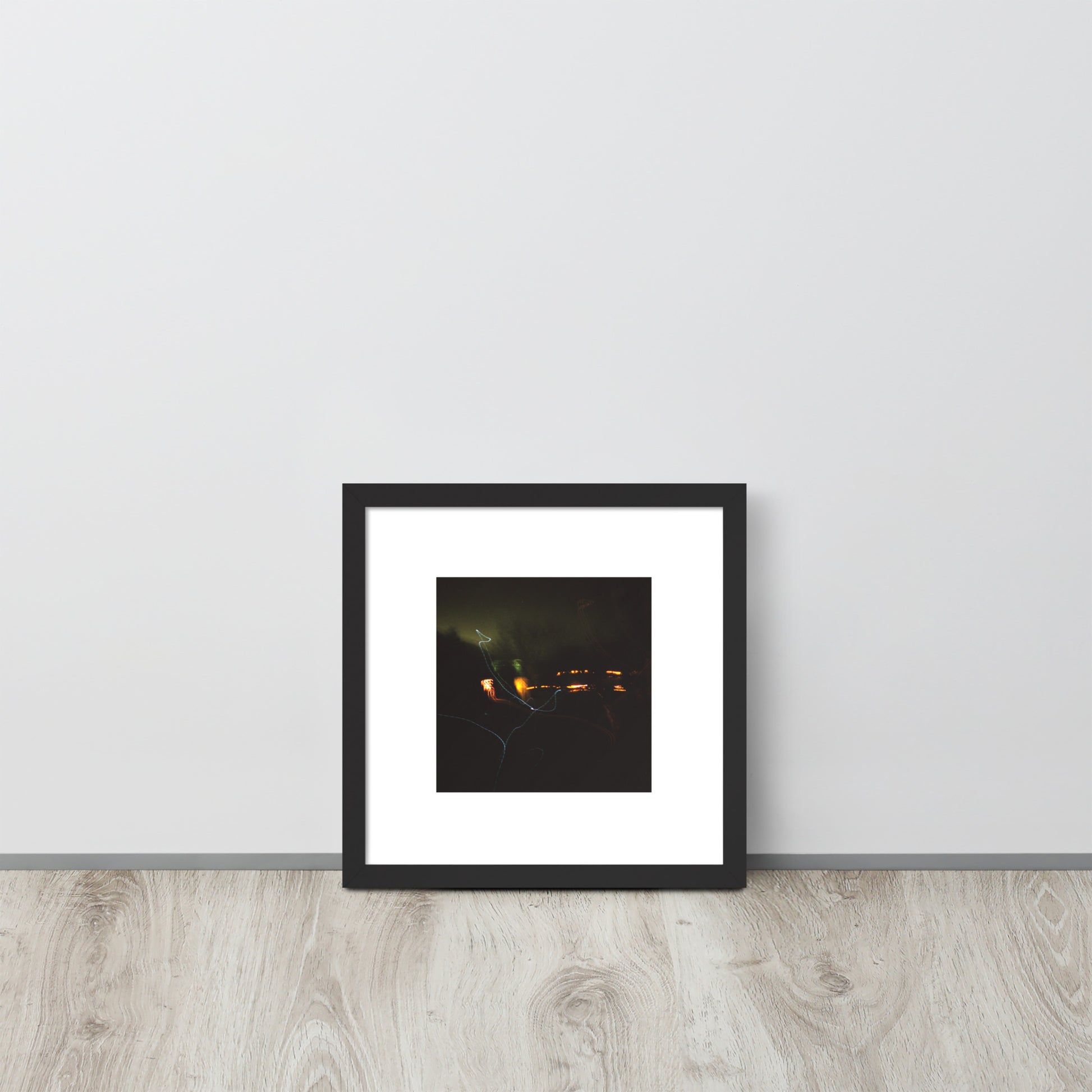 Minimalist streetwear style framed wall art in matte black, featuring a 'Night Light' photograph. / Night Light 額装ポスター（ブラックフレーム）：夜の光の幻想的な風景を捉えた写真。モードストリート系ミニマリスト・インテリアアート。