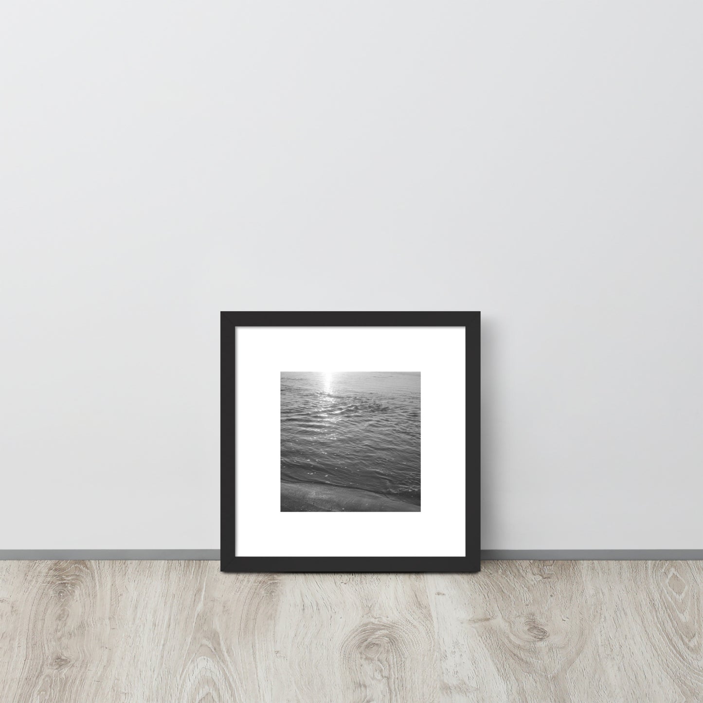 Minimalist mode style framed poster with a black frame, featuring the 'Ocean Beach (B&W)' photograph. / 「Ocean Beach (B&W)」フレーム付ポスター（ブラック）：打ち寄せる波をモノクロで捉えた、モダンでミニマルなインテリアポスター。