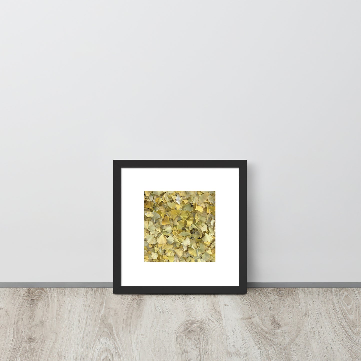 Minimalist art framed matte paper poster in black frame featuring the 'Ginkgo Fallen Leaves' photo art. / フレーム付きマットペーパーポスター（ブラックフレーム）：「イチョウの落ち葉」のフォトアートを配したミニマリストデザイン。