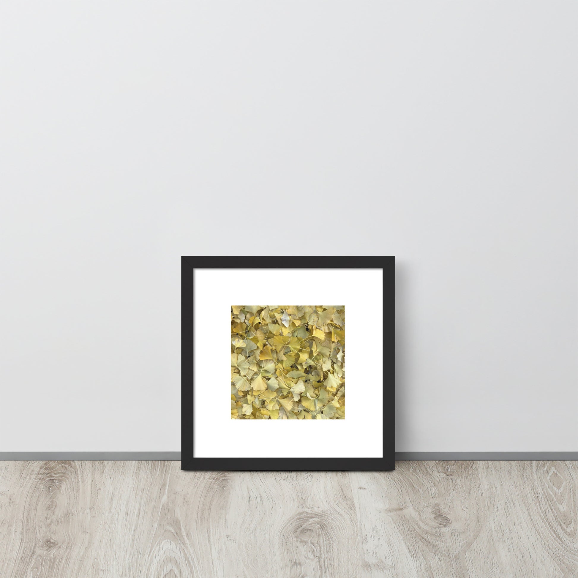 Minimalist art framed matte paper poster in black frame featuring the 'Ginkgo Fallen Leaves' photo art. / フレーム付きマットペーパーポスター（ブラックフレーム）：「イチョウの落ち葉」のフォトアートを配したミニマリストデザイン。