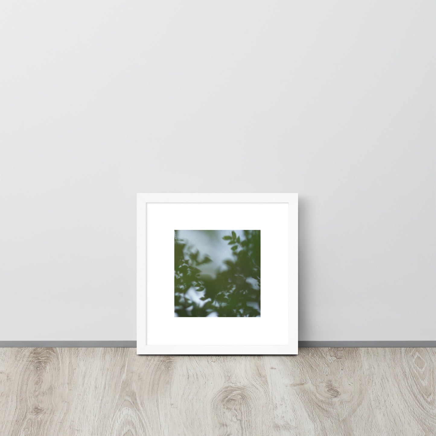 Minimalist streetwear style framed wall art in matte white, featuring a 'Tree Branches' botanical photograph. / Tree Branches 額装ポスター（ホワイトフレーム）：クリーンな白枠がモダンな空間を演出する、モードストリート系ミニマリスト・インテリアアート。
