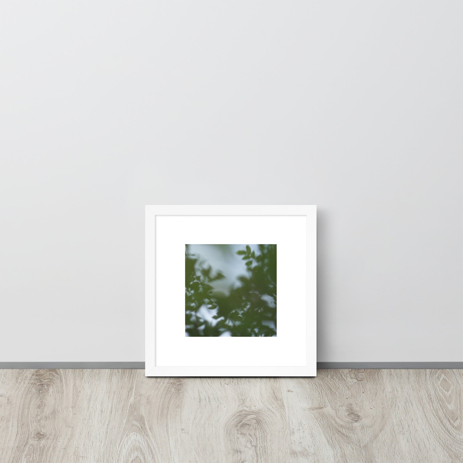 Minimalist streetwear style framed wall art in matte white, featuring a 'Tree Branches' botanical photograph. / Tree Branches 額装ポスター（ホワイトフレーム）：クリーンな白枠がモダンな空間を演出する、モードストリート系ミニマリスト・インテリアアート。