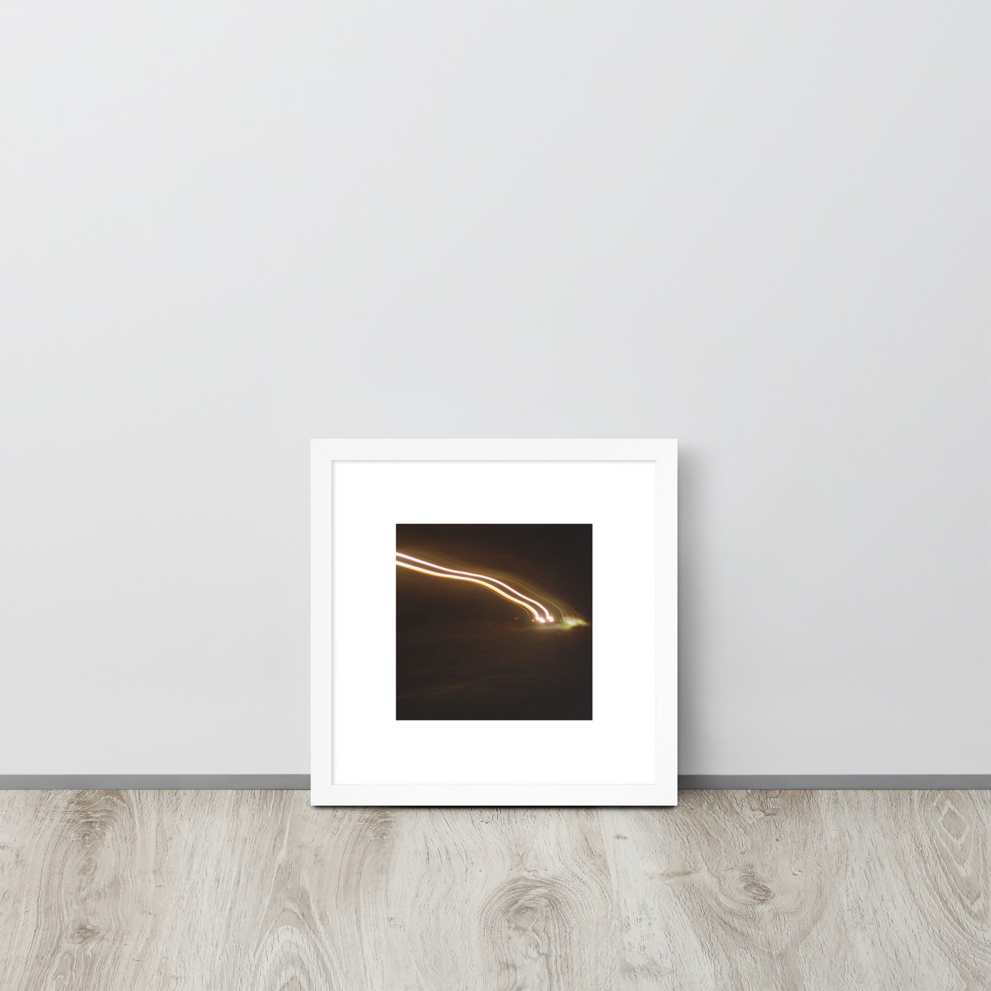 Minimalist streetwear style framed wall art in matte white, featuring a 'Night Car Lights' photograph. / Night Car Lights 額装ポスター（ホワイトフレーム）：クリーンな白枠がモダンな空間を演出する、都会的夜景のモードストリート系インテリアアート。