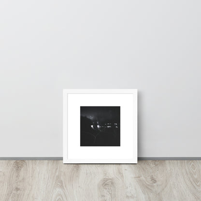 Minimalist streetwear style framed wall art in matte white, featuring a 'Night Light (B&W)' photograph. / Night Light (B&W) 額装ポスター（ホワイトフレーム）：クリーンな白枠がモダンな空間を演出する、夜の光のモノクロ風景を捉えたモードストリート系インテリアアート。
