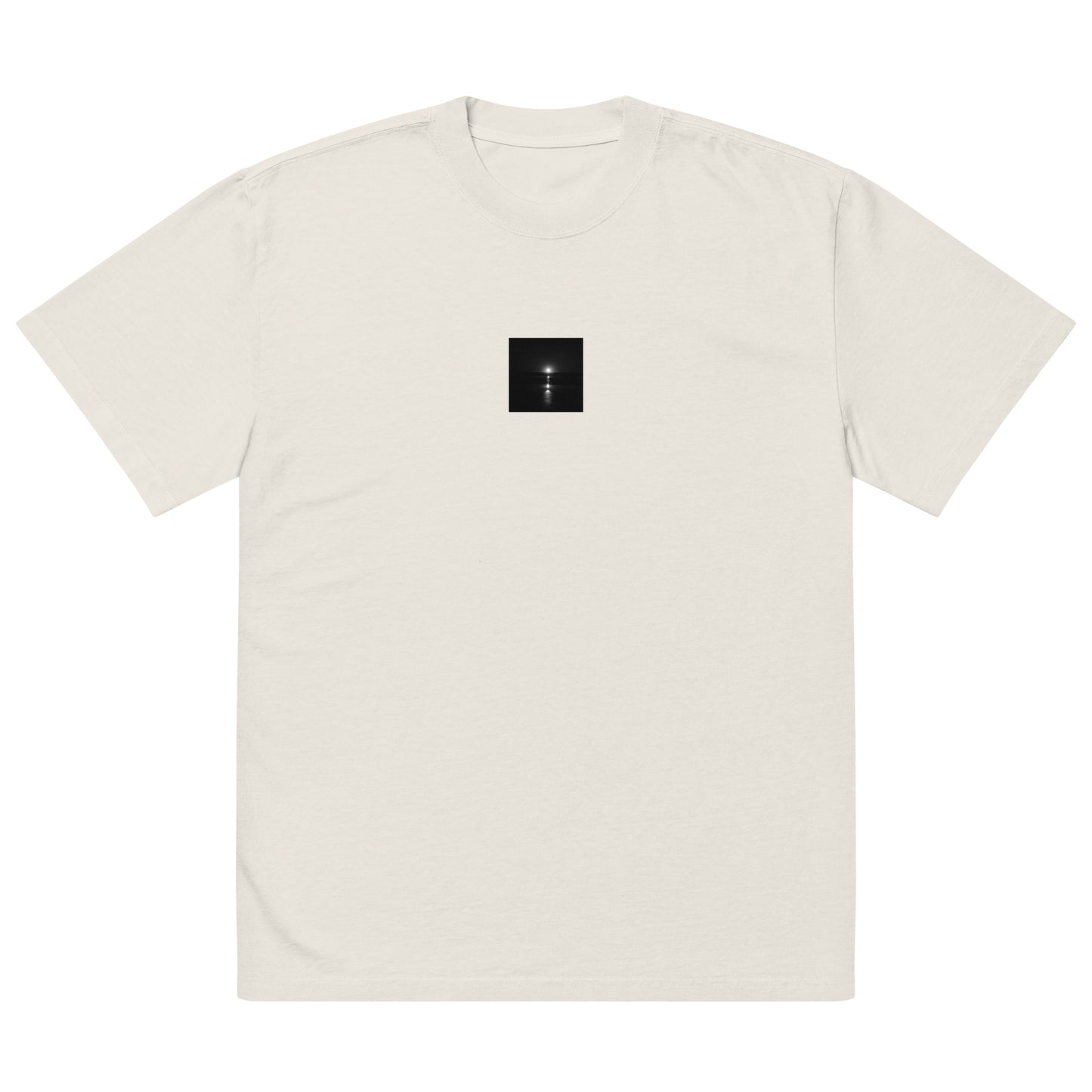 Minimalist streetwear style oversized faded T-shirt in faded bone, featuring the 'Ocean Sunbeams (B&W)' photograph. / 「Ocean Sunbeams (B&W)」オーバーサイズTシャツ（フェードボーン）：柔らかなオフホワイトにモノクロのコントラストが際立つ、清潔感のあるモードストリートTシャツ。