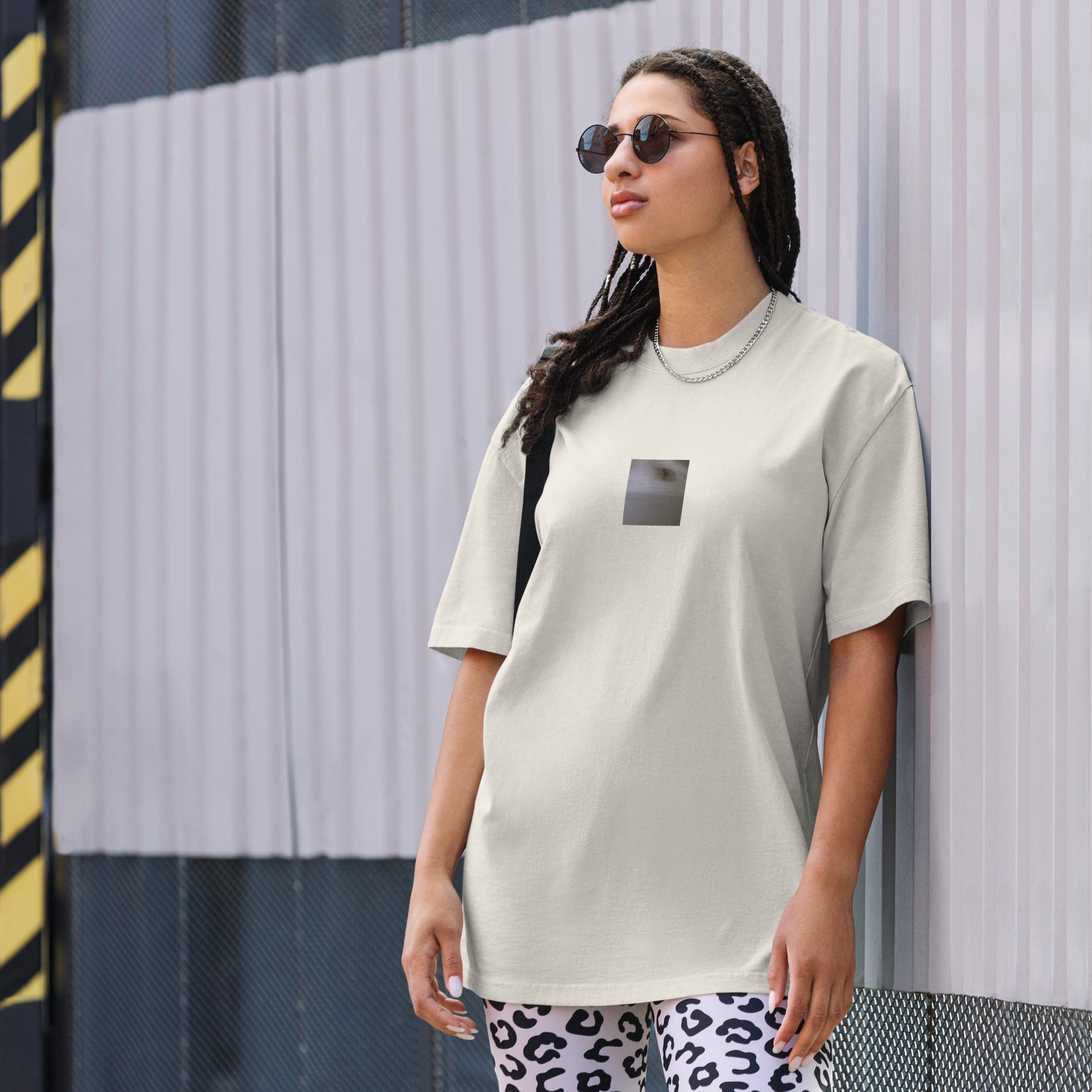 Minimalist streetwear style oversized faded T-shirt in bone featuring the 'Cat (B&W)' photo art on the front. / モードストリート系オーバーサイズ・フェードTシャツ（ボーン）フロントに「猫（モノクロ）」のフォトアートを配したデザイン。