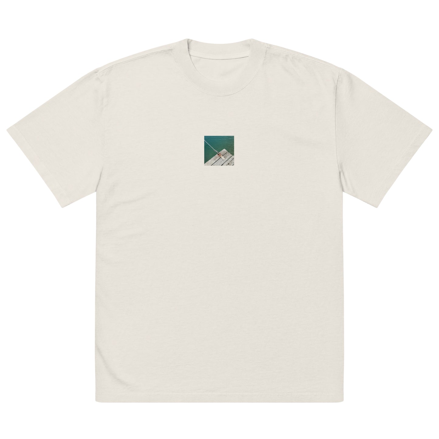 Minimalist streetwear style oversized faded T-shirt in bone featuring the 'Sea, Pier and Rope' photo art on the front. / モードストリート系オーバーサイズ・フェードTシャツ（ボーン）フロントに「海、桟橋、ロープ」のフォトアートを配したデザイン。