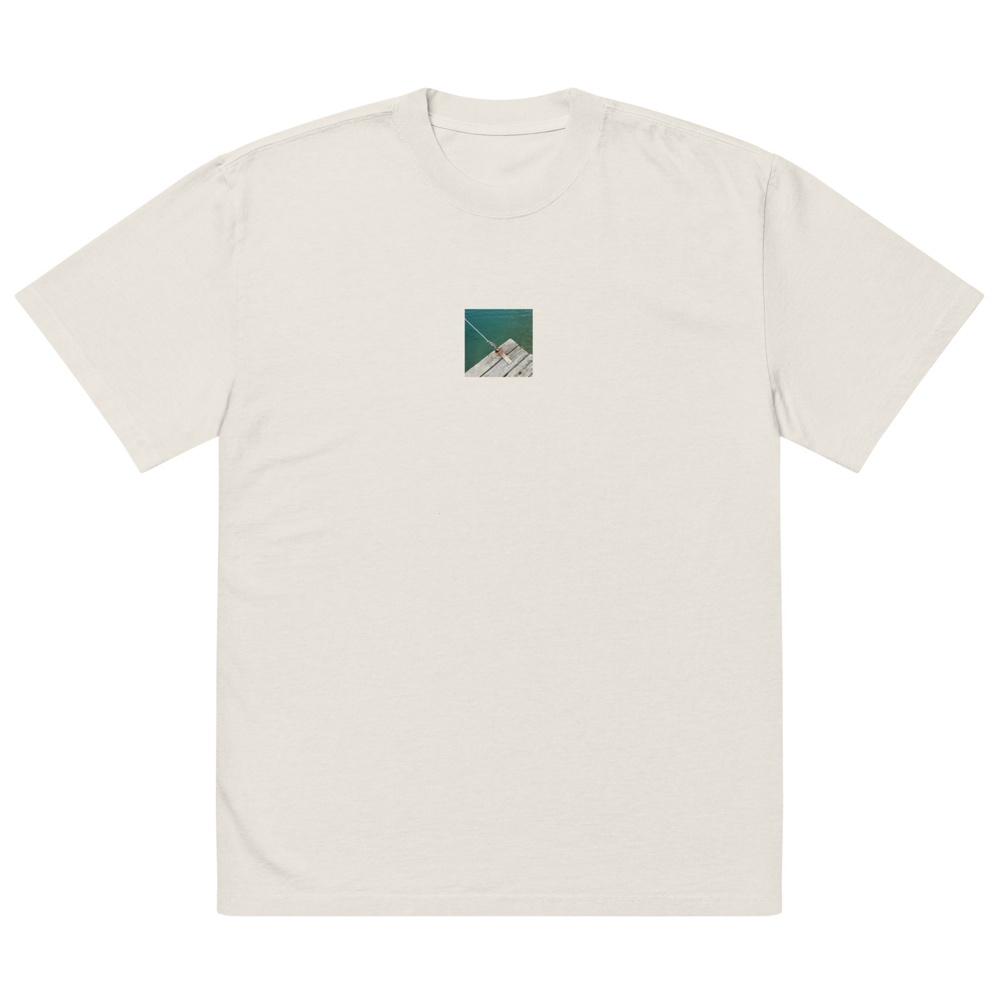 Minimalist streetwear style oversized faded T-shirt in bone featuring the 'Sea, Pier and Rope' photo art on the front. / モードストリート系オーバーサイズ・フェードTシャツ（ボーン）フロントに「海、桟橋、ロープ」のフォトアートを配したデザイン。