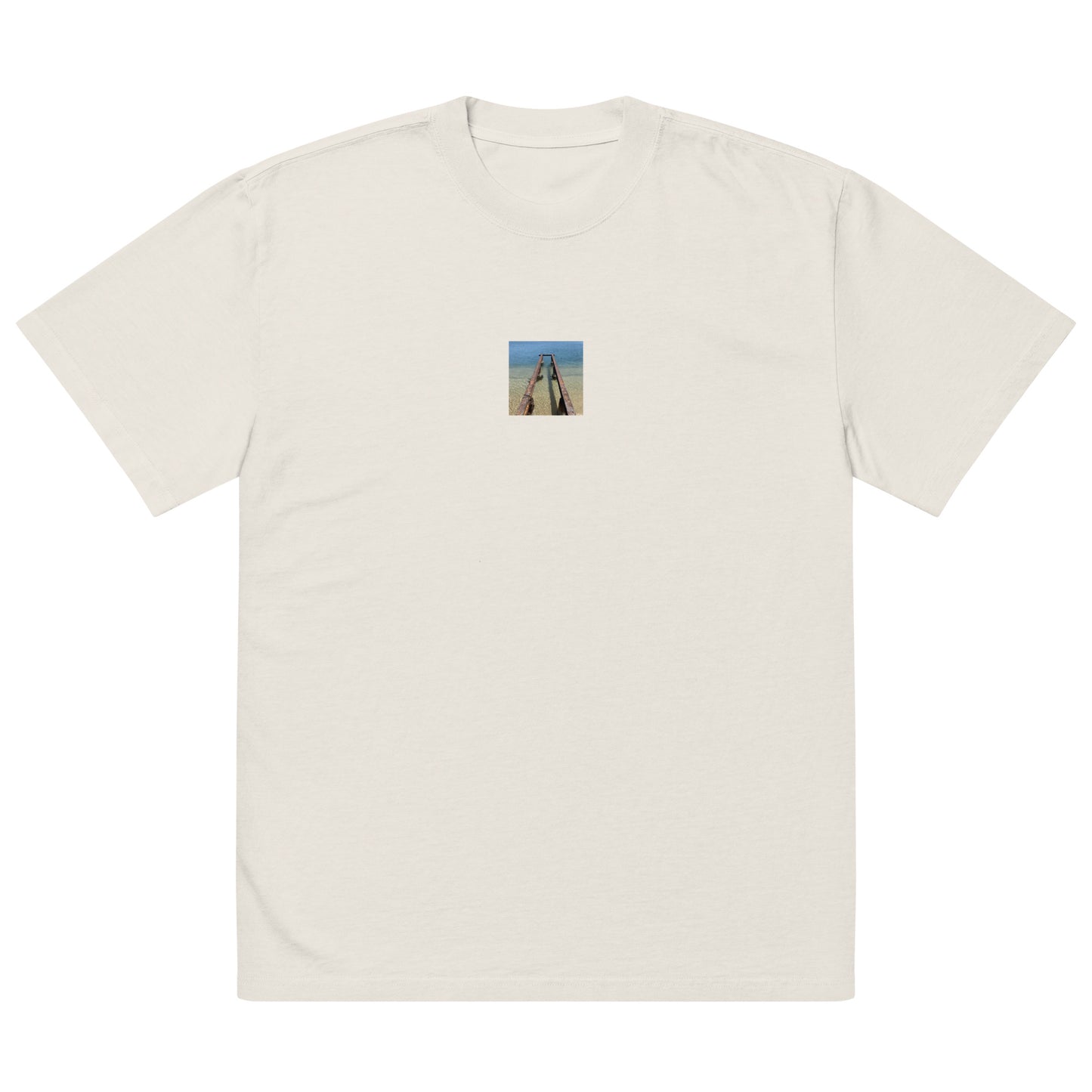 Minimalist streetwear style oversized faded T-shirt in bone featuring the 'Sea and Pier' photo art on the front. / モードストリート系オーバーサイズ・フェードTシャツ（ボーン）フロントに「海と桟橋」のフォトアートを配したデザイン。