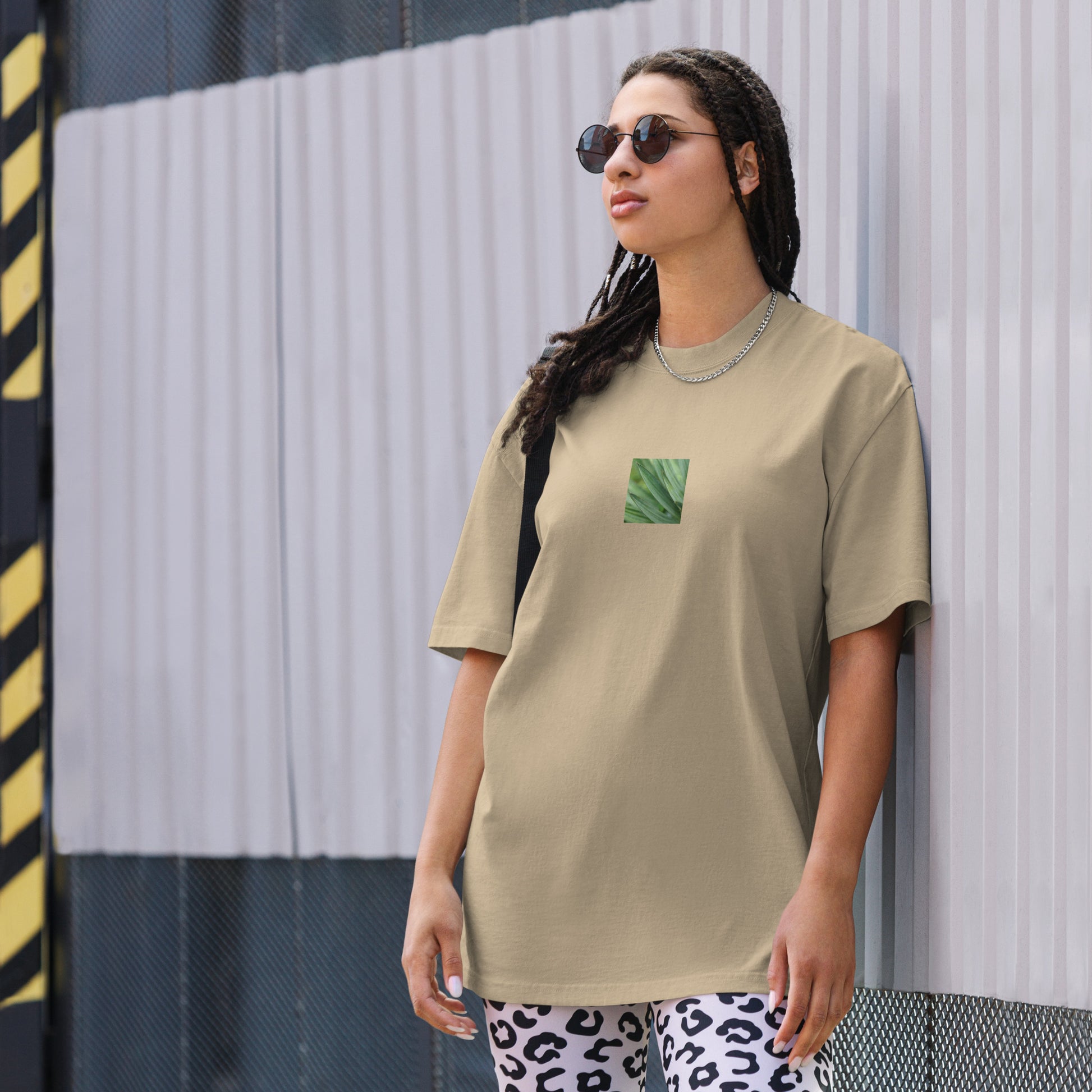 Minimalist streetwear style unisex oversized faded T-shirt in washed khaki, featuring a vibrant Yucca plant color photograph on the chest. An earthy, modern look with a relaxed, premium silhouette. / モードストリート系ユニセックス・フェードカーキ・オーバーサイズTシャツ。フロントにユッカ植物のカラー写真プリント。落ち着いた色味とウォッシュ加工が魅力のミニマリスト・ストリートウェア。