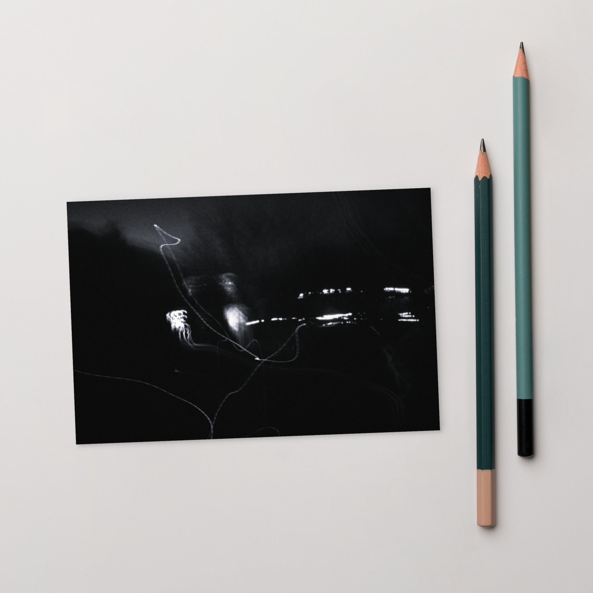 Minimalist streetwear style postcard featuring an artistic 'Night Light (B&W)' photograph. Printed on thick, durable matte cardstock. / Night Light (B&W) ポストカード：夜の光の幻想的な風景をモノクロで捉えたアート写真。モードストリート系ミニマリストのための洗練されたデザイン。