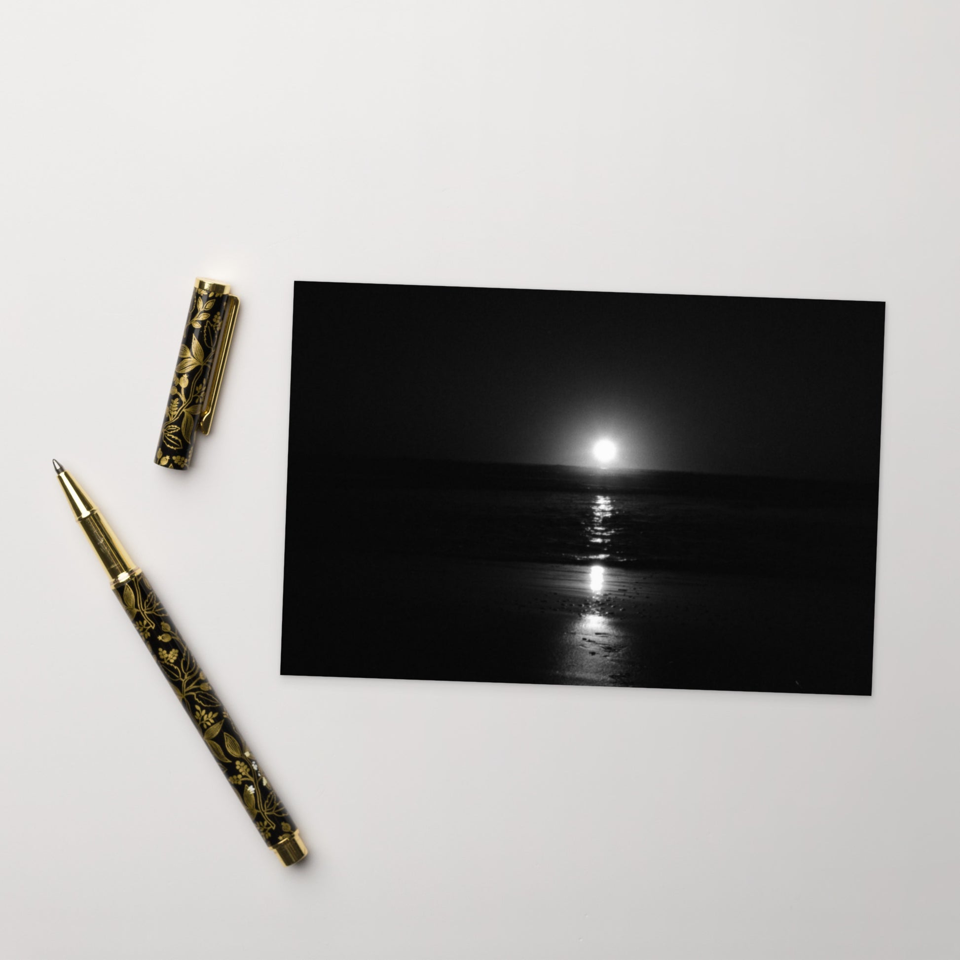Minimalist postcard featuring the 'Ocean Sunbeams (B&W)' photograph, perfect as a greeting card or miniature art print. / 「Ocean Sunbeams (B&W)」ポストカード：海面に反射する光をモノクロで捉えた、洗練されたミニマルなデザインのアートポストカード。