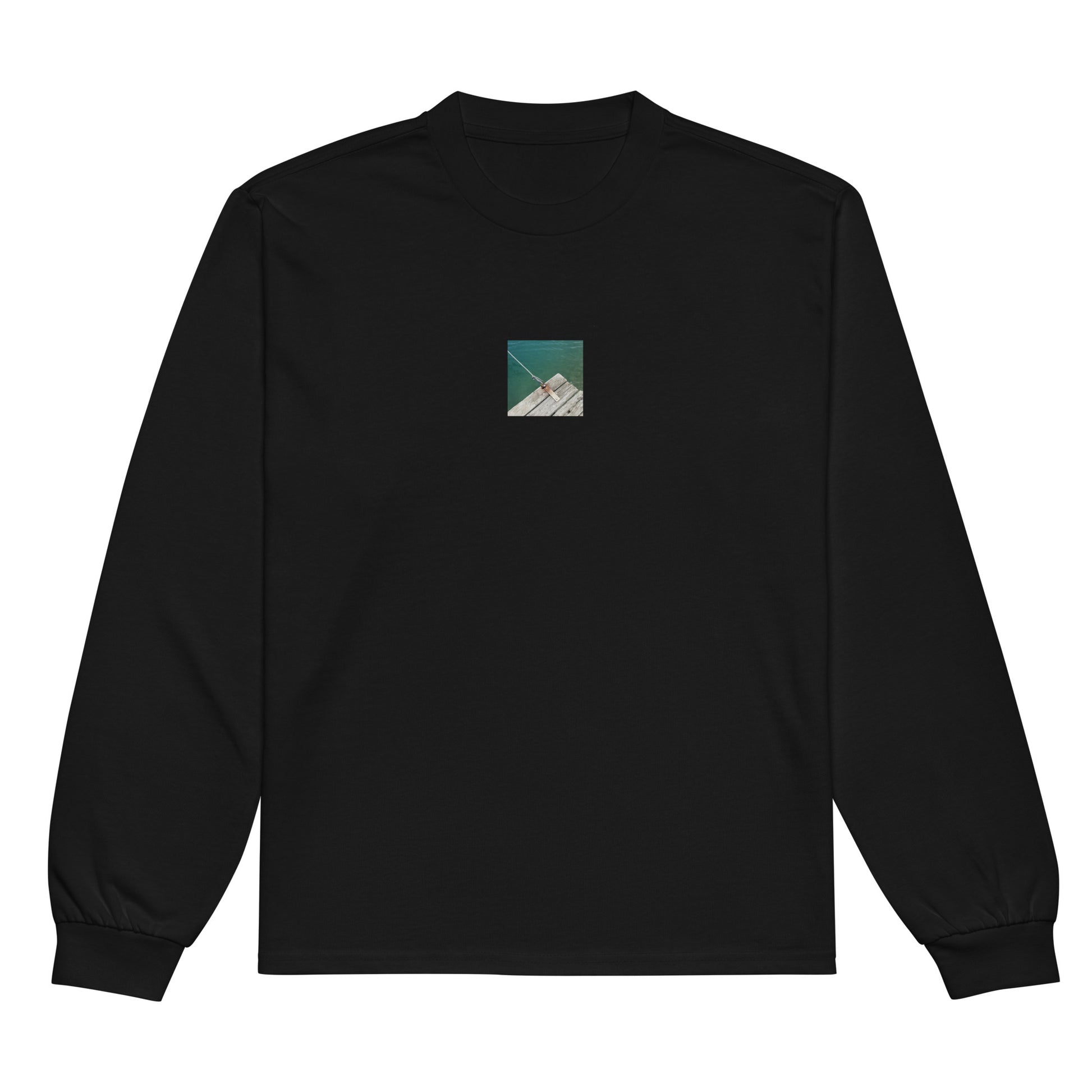 Minimalist streetwear style premium heavyweight long sleeve shirt in black featuring the 'Sea, Pier and Rope' photo art on the front. / モードストリート系プレミアム・ヘビーウェイト長袖Tシャツ（ブラック）フロントに「海、桟橋、ロープ」のフォトアートを配したデザイン。