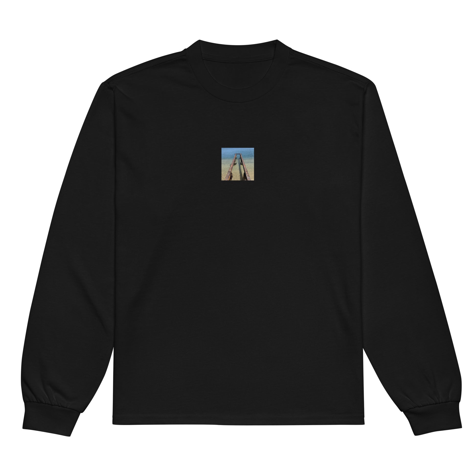 Minimalist streetwear style premium heavyweight long sleeve shirt in black featuring the 'Sea and Pier' photo art on the front. / モードストリート系プレミアム・ヘビーウェイト長袖Tシャツ（ブラック）フロントに「海と桟橋」のフォトアートを配したデザイン。