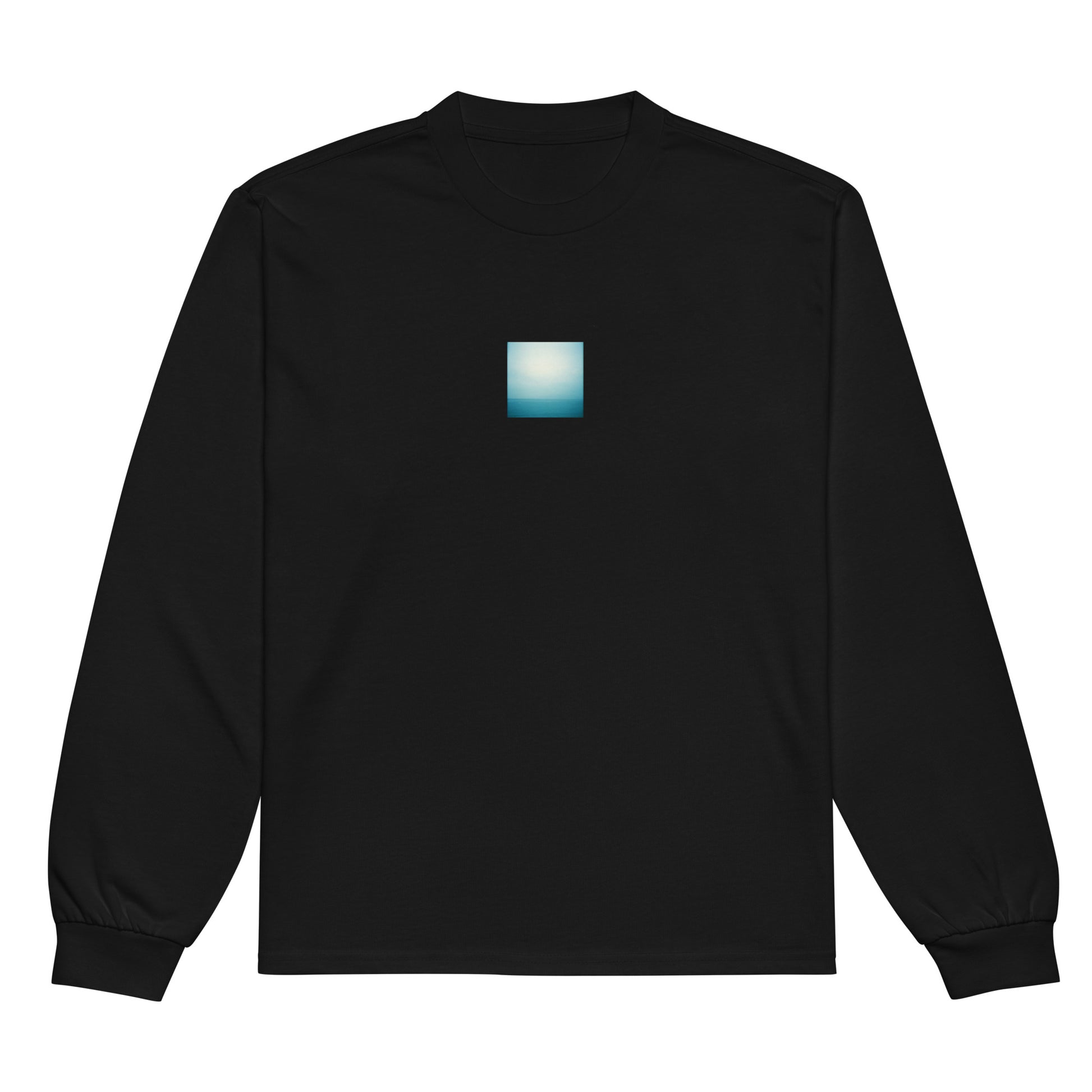 Minimalist streetwear style premium heavyweight long sleeve shirt in black featuring the 'Ocean Horizon' photo art on the front. / モードストリート系プレミアム・ヘビーウェイト長袖Tシャツ（ブラック）フロントに「海の水平線」のフォトアートを配したデザイン。