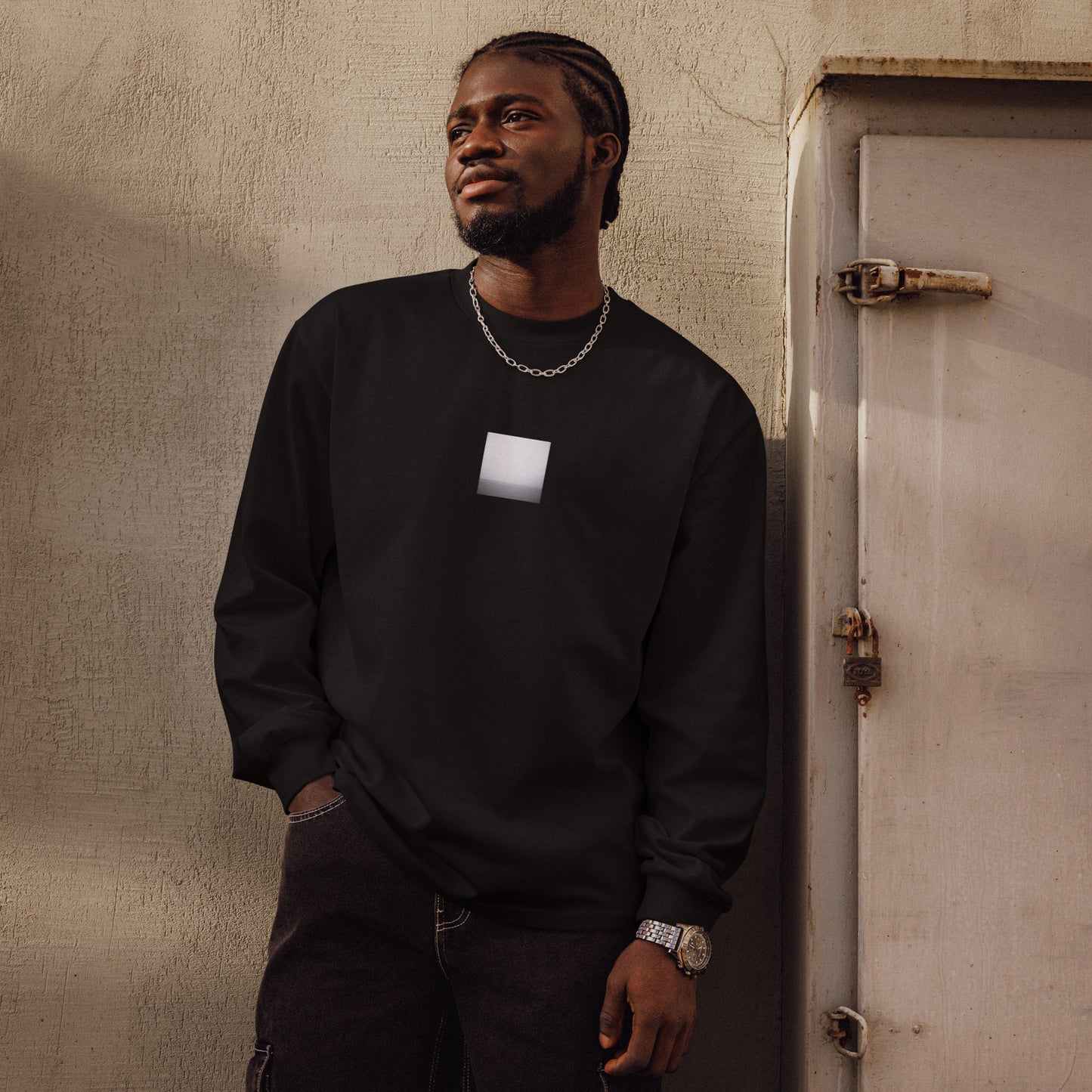 Minimalist streetwear style premium heavyweight long sleeve shirt in black featuring the 'Ocean Horizon (B&W)' photo art on the front. / モードストリート系プレミアム・ヘビーウェイト長袖Tシャツ（ブラック）フロントに「オーシャンホライズン (モノクロ)」のフォトアートを配したデザイン。