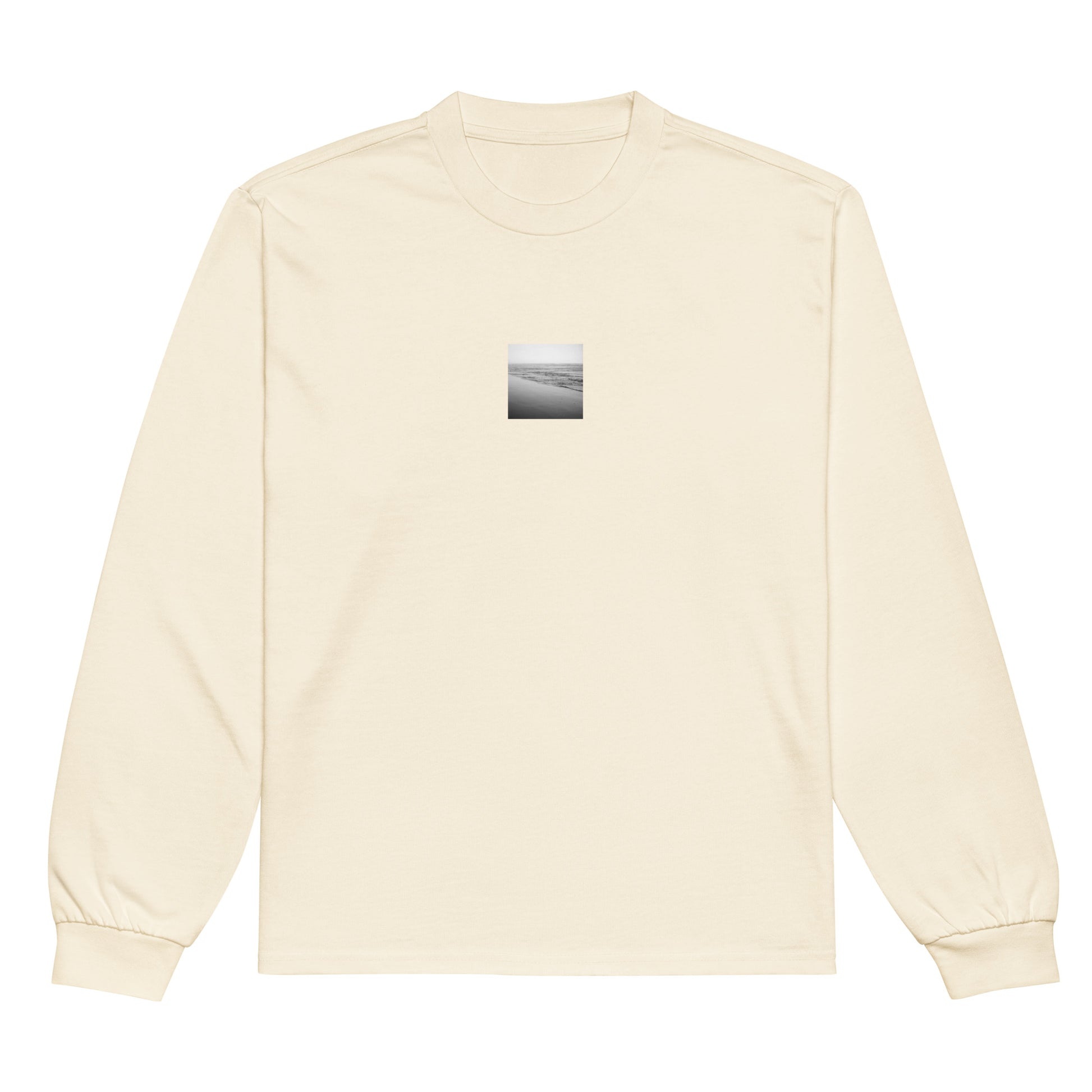 Minimalist streetwear style unisex premium long sleeve shirt in ecru with 'Ocean Beach (B&W)' photo art print. / フロントに「オーシャン・ビーチ（モノクロ）」のフォトアートプリントを配した、モードストリート系プレミアム長袖Tシャツ（エクリュ）。