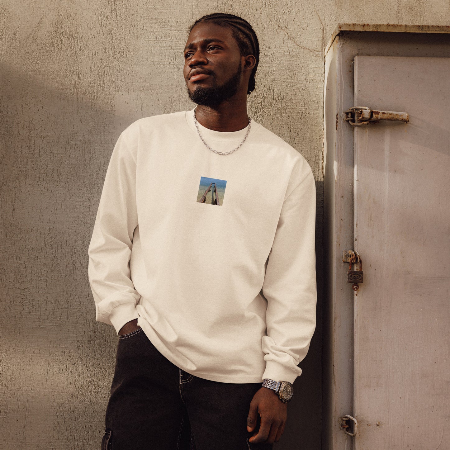 Minimalist streetwear style premium heavyweight long sleeve shirt in ecru featuring the 'Sea and Pier' photo art on the front. / モードストリート系プレミアム・ヘビーウェイト長袖Tシャツ（エクリュ）フロントに「海と桟橋」のフォトアートを配したデザイン。