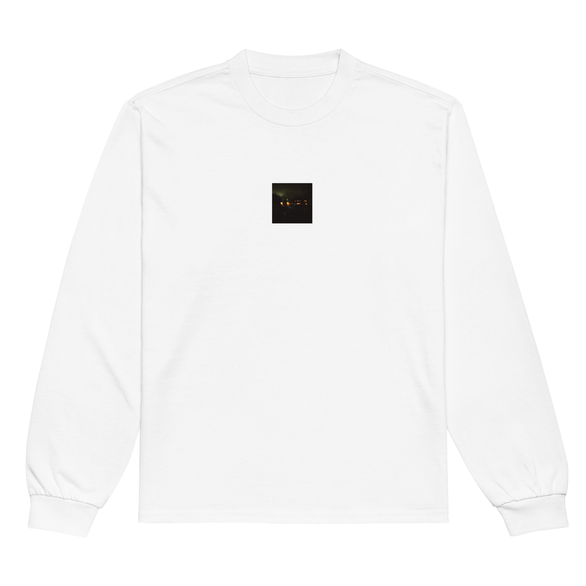 Minimalist streetwear style unisex premium heavyweight long sleeve shirt in white, featuring a 'Night Light' photograph print. / Night Light プレミアム・ヘビーウェイト長袖Tシャツ（ホワイト）：清潔感のある白地に、夜の光の温かみを捉えた写真デザインが際立つ長袖Tシャツ。