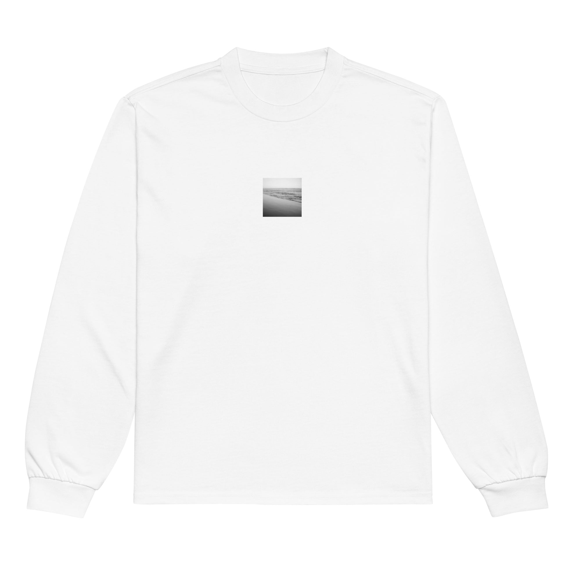 Minimalist streetwear style unisex premium long sleeve shirt in white with 'Ocean Beach (B&W)' photo art print. / フロントに「オーシャン・ビーチ（モノクロ）」のフォトアートプリントを配した、モードストリート系プレミアム長袖Tシャツ（ホワイト）。