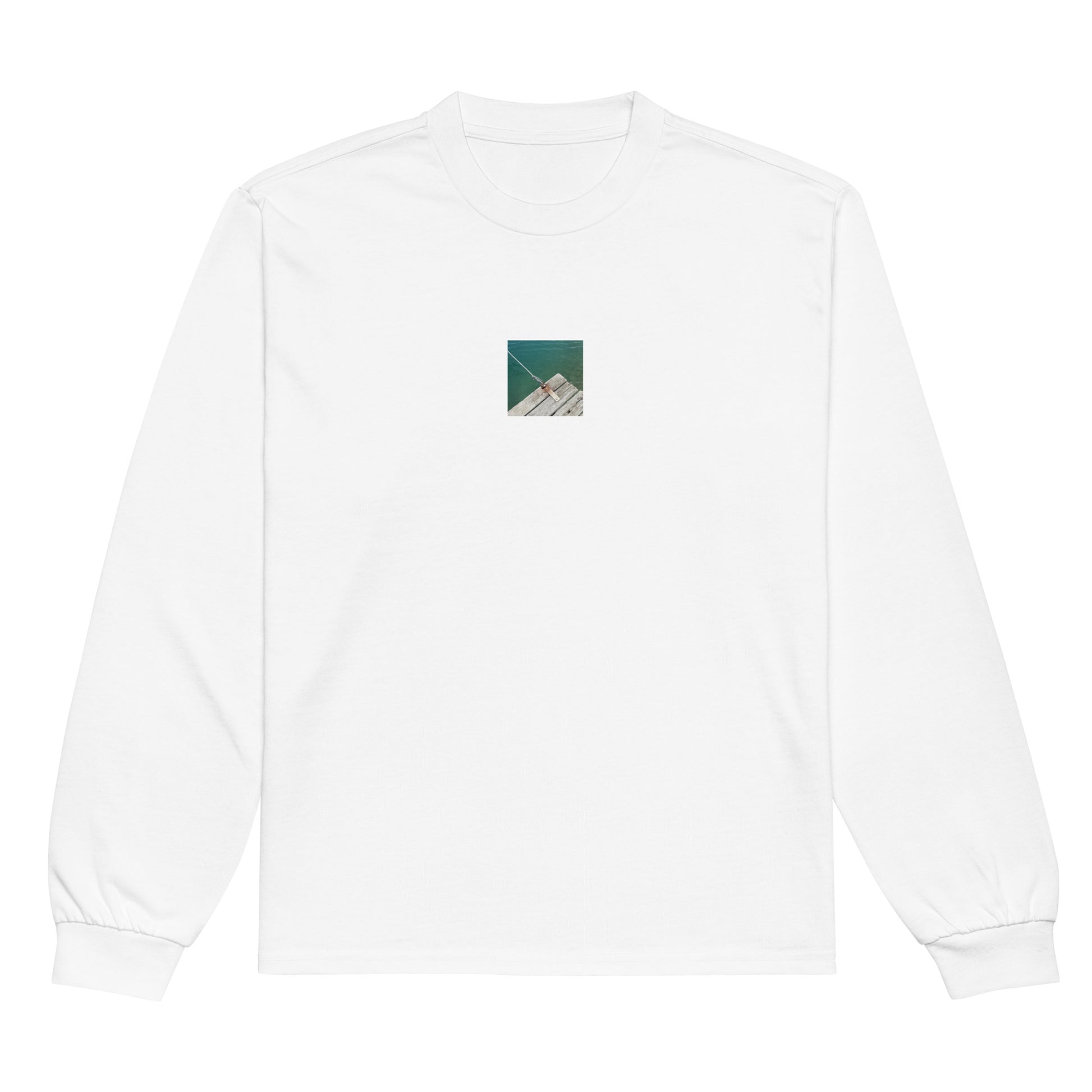 Minimalist streetwear style premium heavyweight long sleeve shirt in white featuring the 'Sea, Pier and Rope' photo art on the front. / モードストリート系プレミアム・ヘビーウェイト長袖Tシャツ（ホワイト）フロントに「海、桟橋、ロープ」のフォトアートを配したデザイン。
