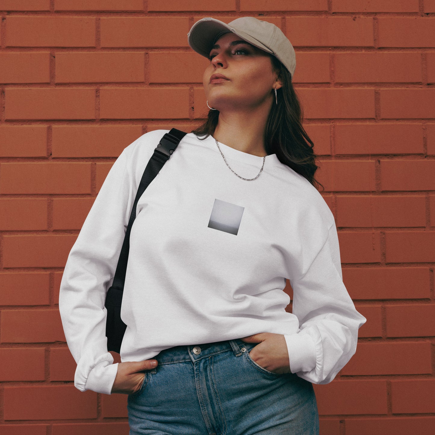 Minimalist streetwear style premium heavyweight long sleeve shirt in white featuring the 'Ocean Horizon (B&W)' photo art on the front. / モードストリート系プレミアム・ヘビーウェイト長袖Tシャツ（ホワイト）フロントに「オーシャンホライズン (モノクロ)」のフォトアートを配したデザイン。