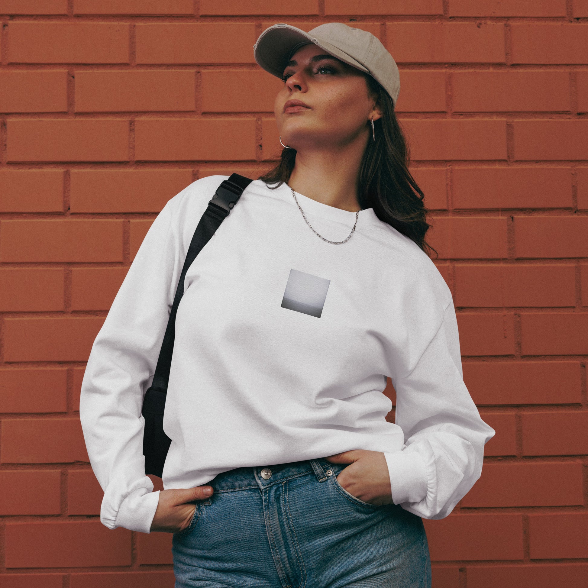 Minimalist streetwear style premium heavyweight long sleeve shirt in white featuring the 'Ocean Horizon (B&W)' photo art on the front. / モードストリート系プレミアム・ヘビーウェイト長袖Tシャツ（ホワイト）フロントに「オーシャンホライズン (モノクロ)」のフォトアートを配したデザイン。