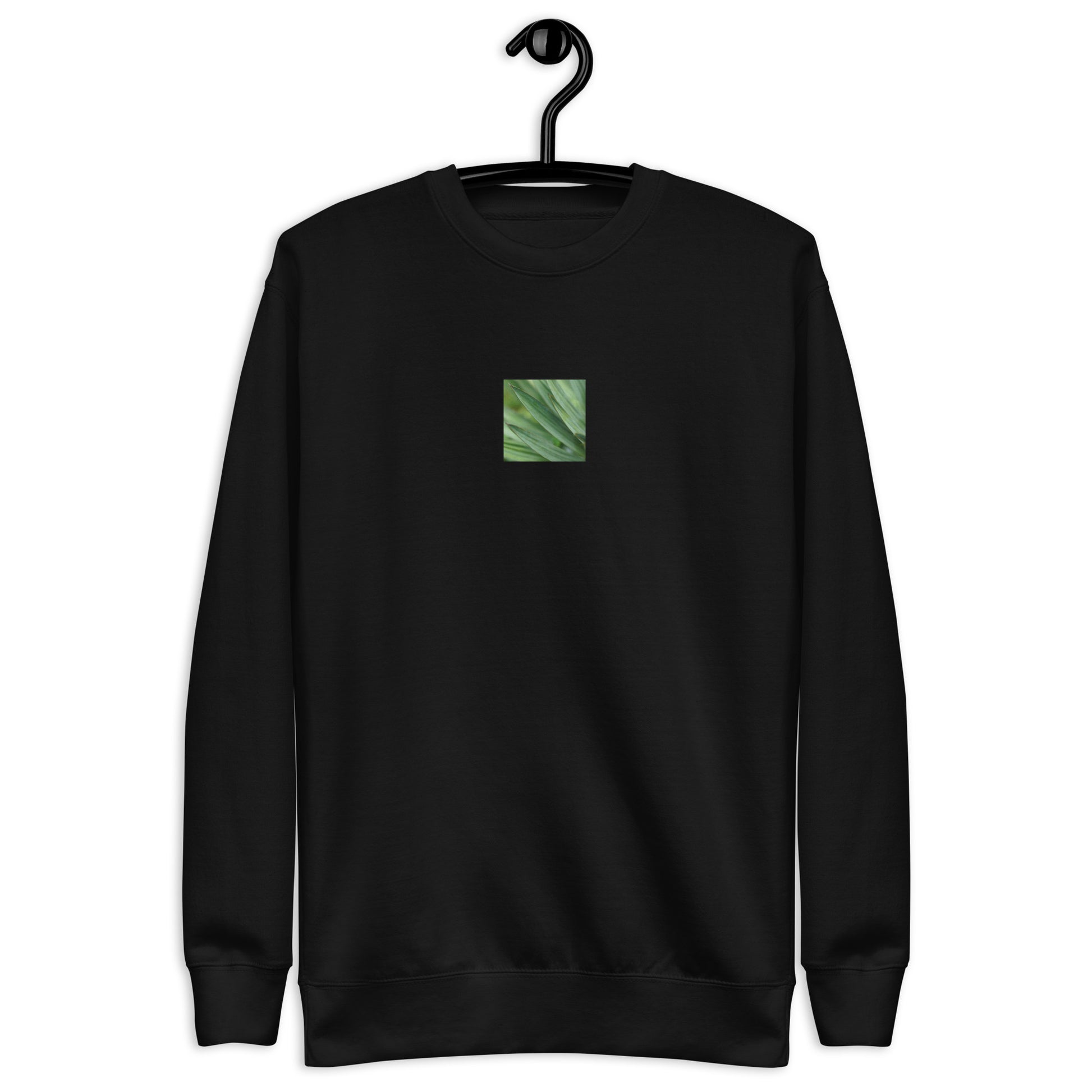 Minimalist streetwear style unisex premium sweatshirt in black, featuring a vibrant Yucca plant color photograph on the chest. A modern, monochromatic staple with a comfortable fleece interior. / モードストリート系ユニセックス・ブラック・プレミアムスウェット。フロントにユッカ植物のカラー写真プリント。内側は暖かなフリース素材。