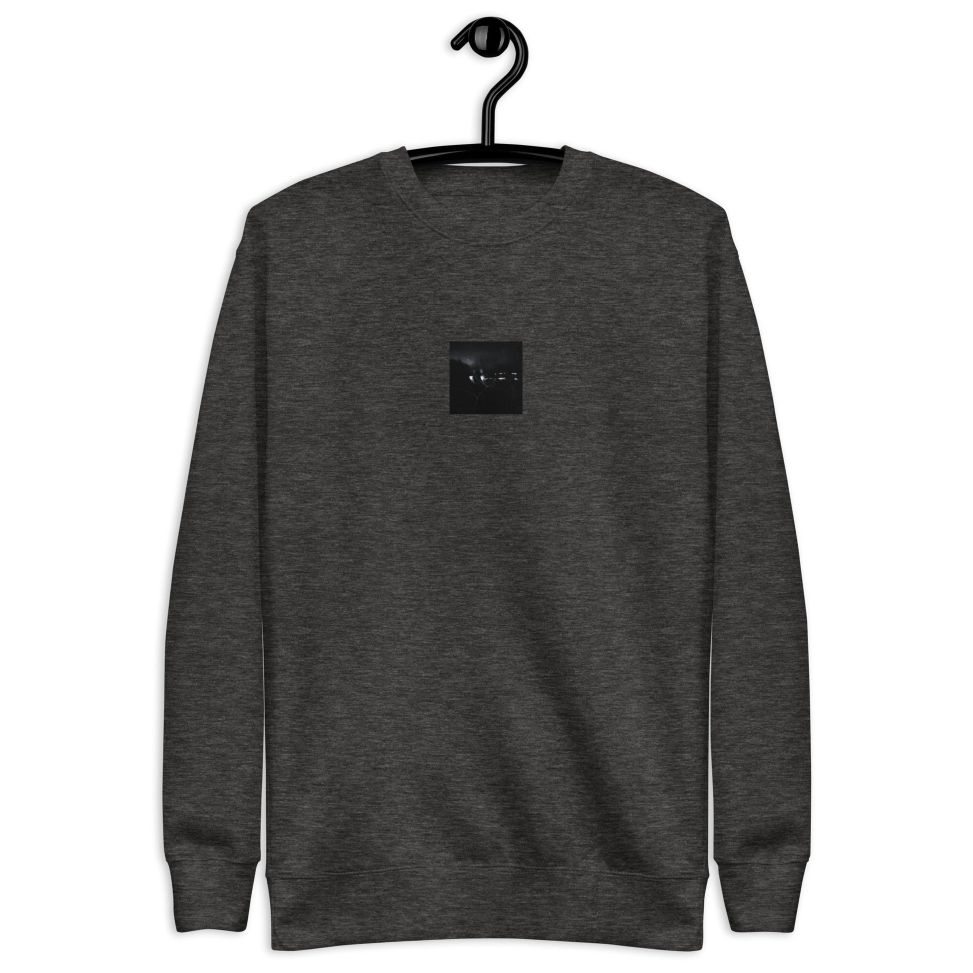 Minimalist streetwear style unisex premium sweatshirt in charcoal heather, featuring a 'Night Light (B&W)' photograph print on the chest. / Night Light (B&W) プレミアム・スウェット（チャコールヘザー）：都会的な杢グレーに夜の光のモノクロ風景写真が映える、モダンでミニマルなモードストリート系スウェット。