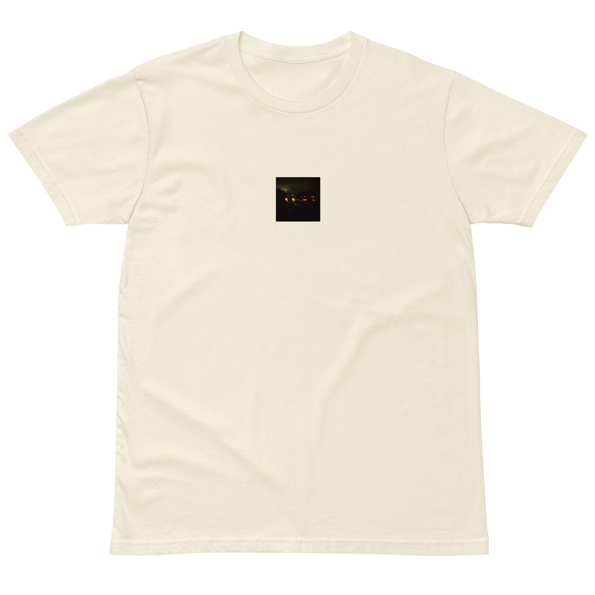 Minimalist streetwear style unisex premium T-shirt in natural, featuring a 'Night Light' photograph print on the chest. / Night Light プレミアムTシャツ（ナチュラル）：自然な風合いに夜の光の風景写真が馴染む、クリーンなモードストリート系Tシャツ。