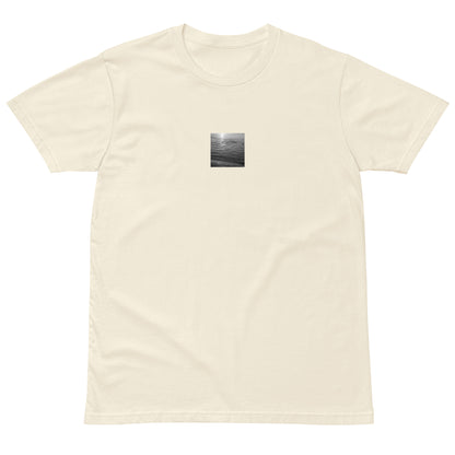 Minimalist streetwear style premium T-shirt in natural, featuring the 'Ocean Beach (B&W)' photograph. / 「Ocean Beach (B&W)」プレミアムTシャツ（ナチュラル）：柔らかな色合いに波のモノクロアートが映える、洗練されたTシャツ。