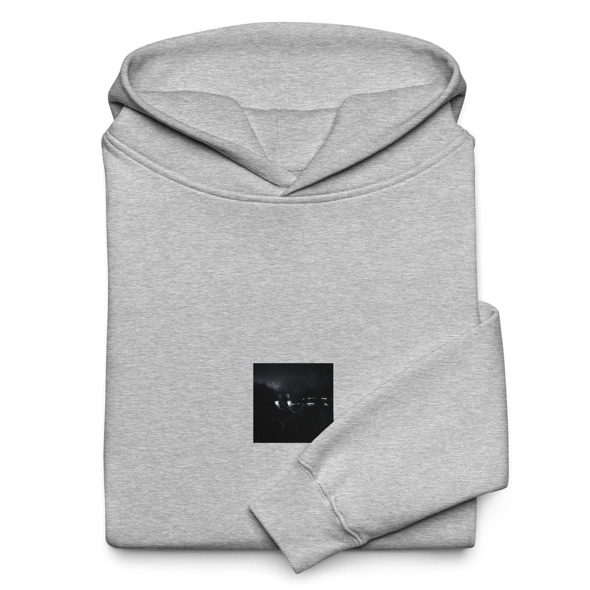 Minimalist streetwear style unisex oversized hoodie in athletic heather, featuring a 'Night Light (B&W)' photograph print on the chest. / Night Light (B&W) オーバーサイズ・フーディー（アスレチックヘザー）：都会的な杢グレーに夜の光のモノクロ風景が馴染む、モードストリートのためのモダンなパーカー。