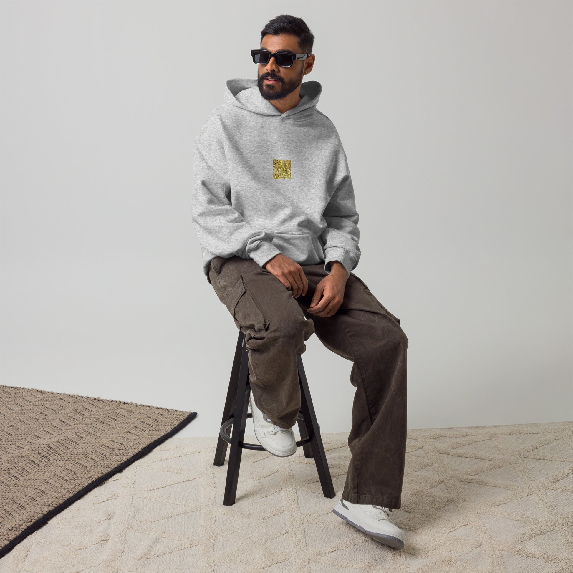 Minimalist streetwear style oversized hoodie in athletic heather featuring the 'Ginkgo Fallen Leaves' photo art on the front. / モードストリート系オーバーサイズフーディー（アスレチックヘザー）フロントに「イチョウの落ち葉」のフォトアートを配したデザイン。