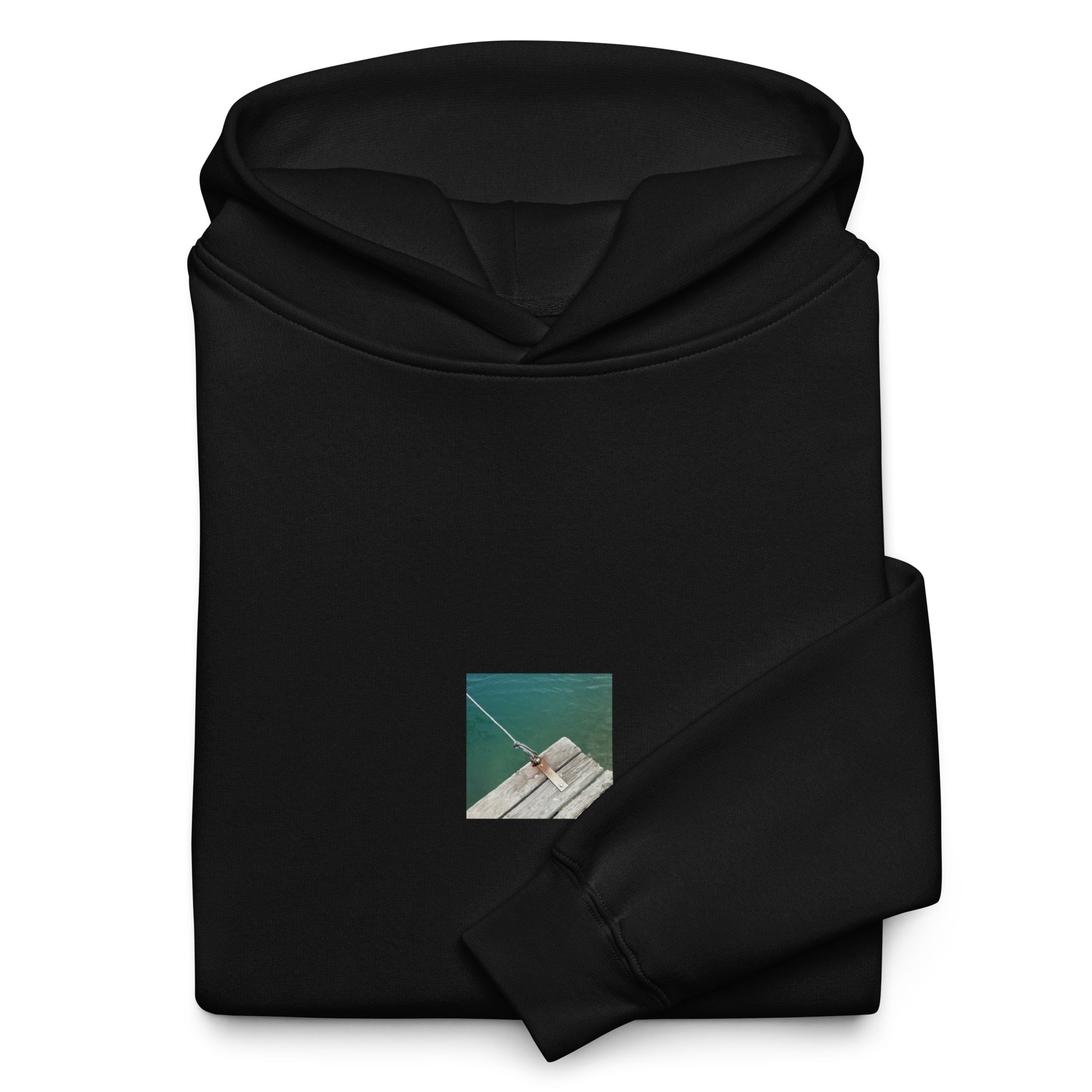 Minimalist streetwear style oversized hoodie in black featuring the 'Sea, Pier and Rope' photo art on the front. / モードストリート系オーバーサイズフーディー（ブラック）フロントに「海、桟橋、ロープ」のフォトアートを配したデザイン。