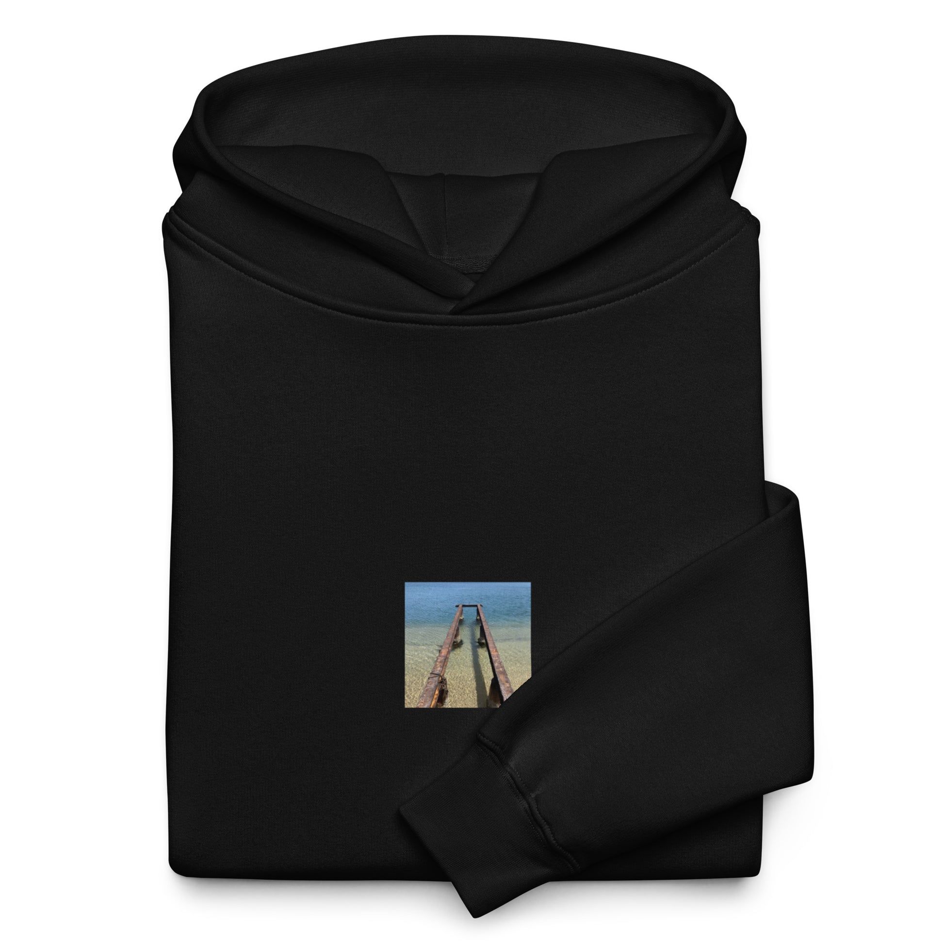 Minimalist streetwear style oversized hoodie in black featuring the 'Sea and Pier' photo art on the front. / モードストリート系オーバーサイズフーディー（ブラック）フロントに「海と桟橋」のフォトアートを配したデザイン。