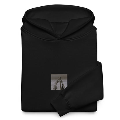Minimalist streetwear style oversized hoodie in black featuring the 'Sea and Pier (B&W)' photo art on the front. / モードストリート系オーバーサイズフーディー（ブラック）フロントに「海と桟橋（モノクロ）」のフォトアートを配したデザイン。