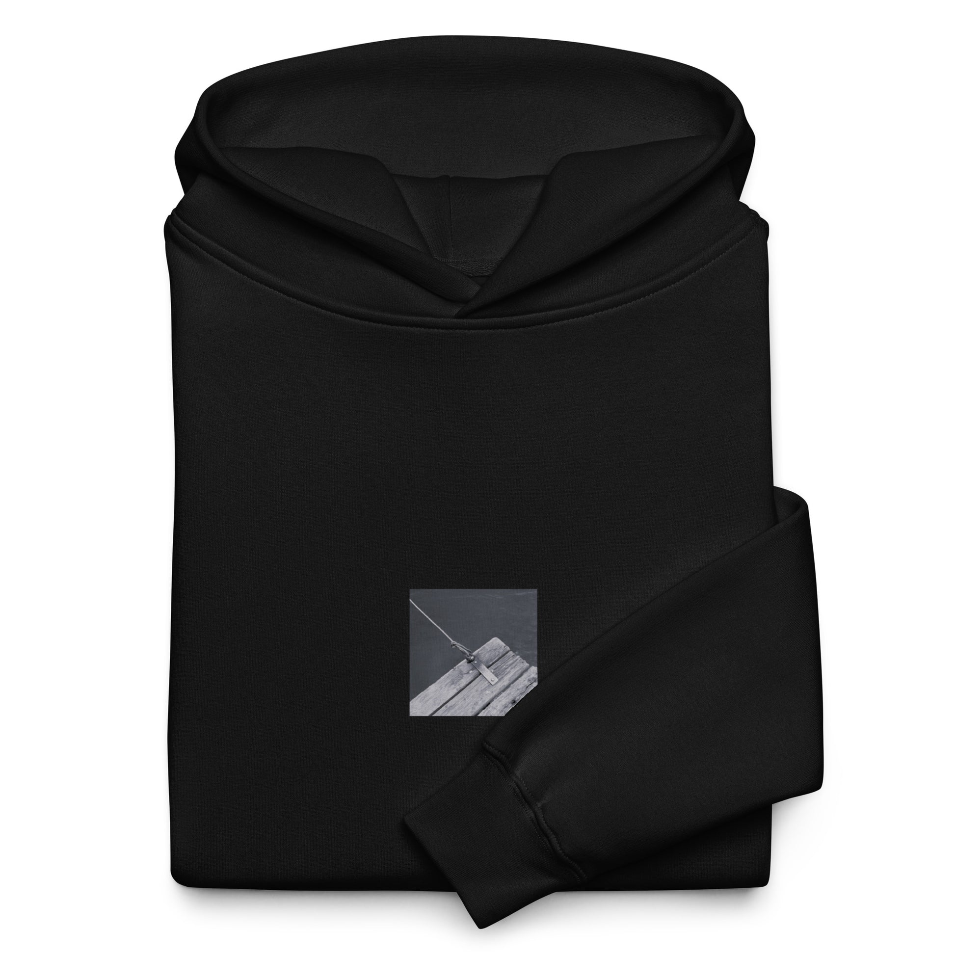 Minimalist streetwear style oversized hoodie in black featuring the 'Ocean Pier (B&W)' photo art on the front. / モードストリート系オーバーサイズフーディー（ブラック）フロントに「海の桟橋 (モノクロ)」のフォトアートを配したデザイン。