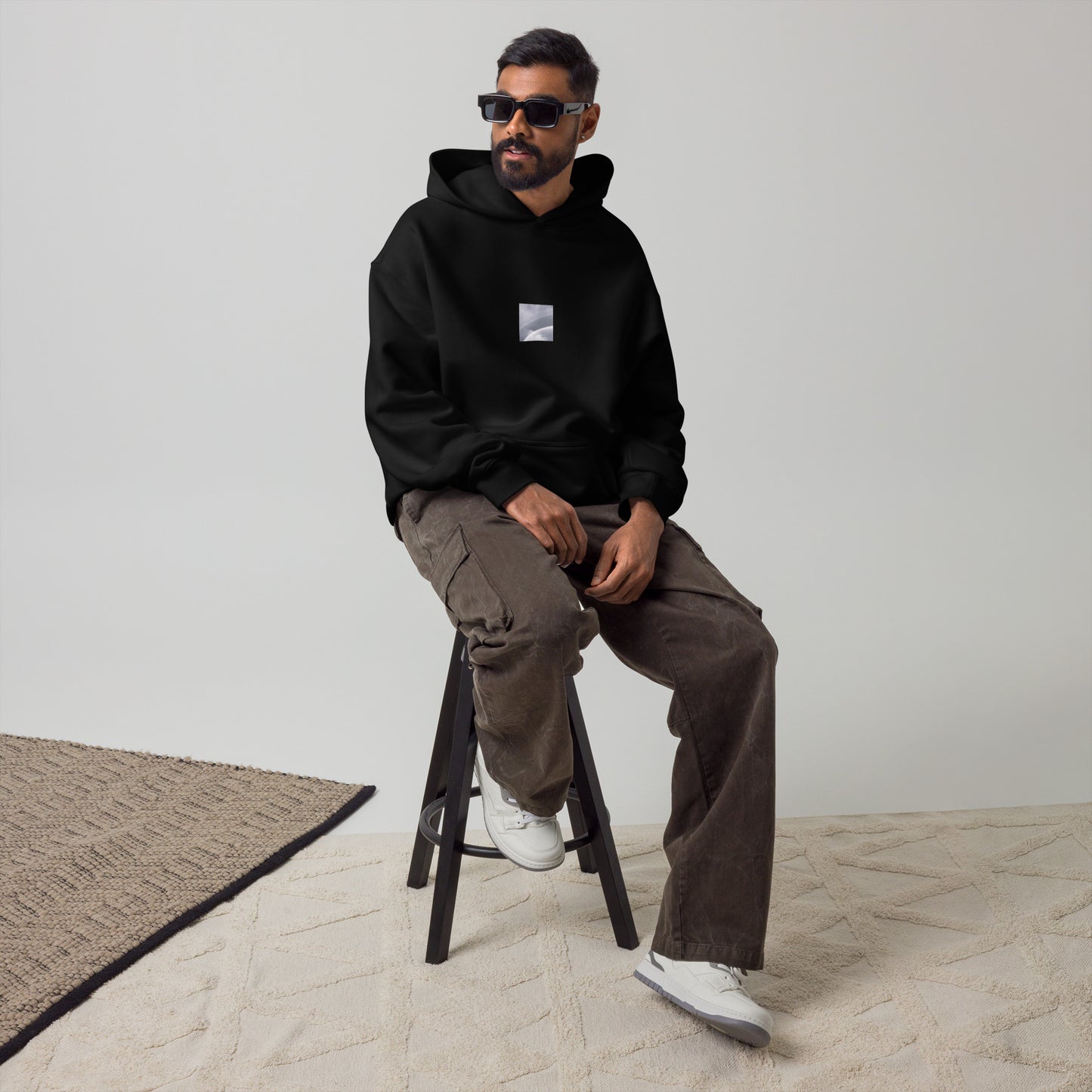 Minimalist streetwear style oversized hoodie in black featuring the 'Double Rainbow (B&W)' photo art on the front. / モードストリート系オーバーサイズフーディー（ブラック）フロントに「ダブルレインボー (モノクロ)」のフォトアートを配したデザイン。