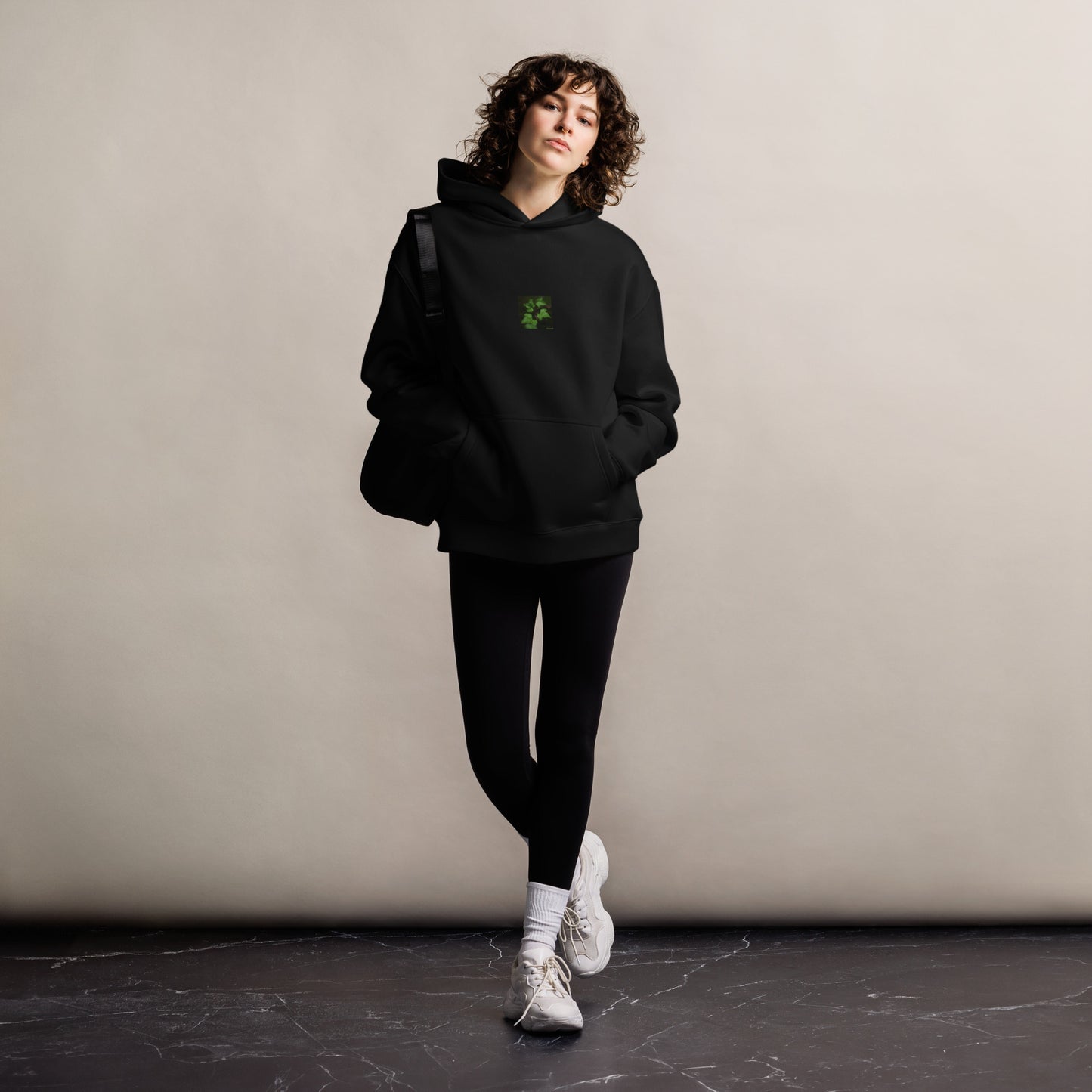 Minimalist streetwear style oversized hoodie in black featuring the 'ivy' photo art on the front. / モードストリート系オーバーサイズフーディー（ブラック）フロントに「アイビー」のフォトアートを配したデザイン。