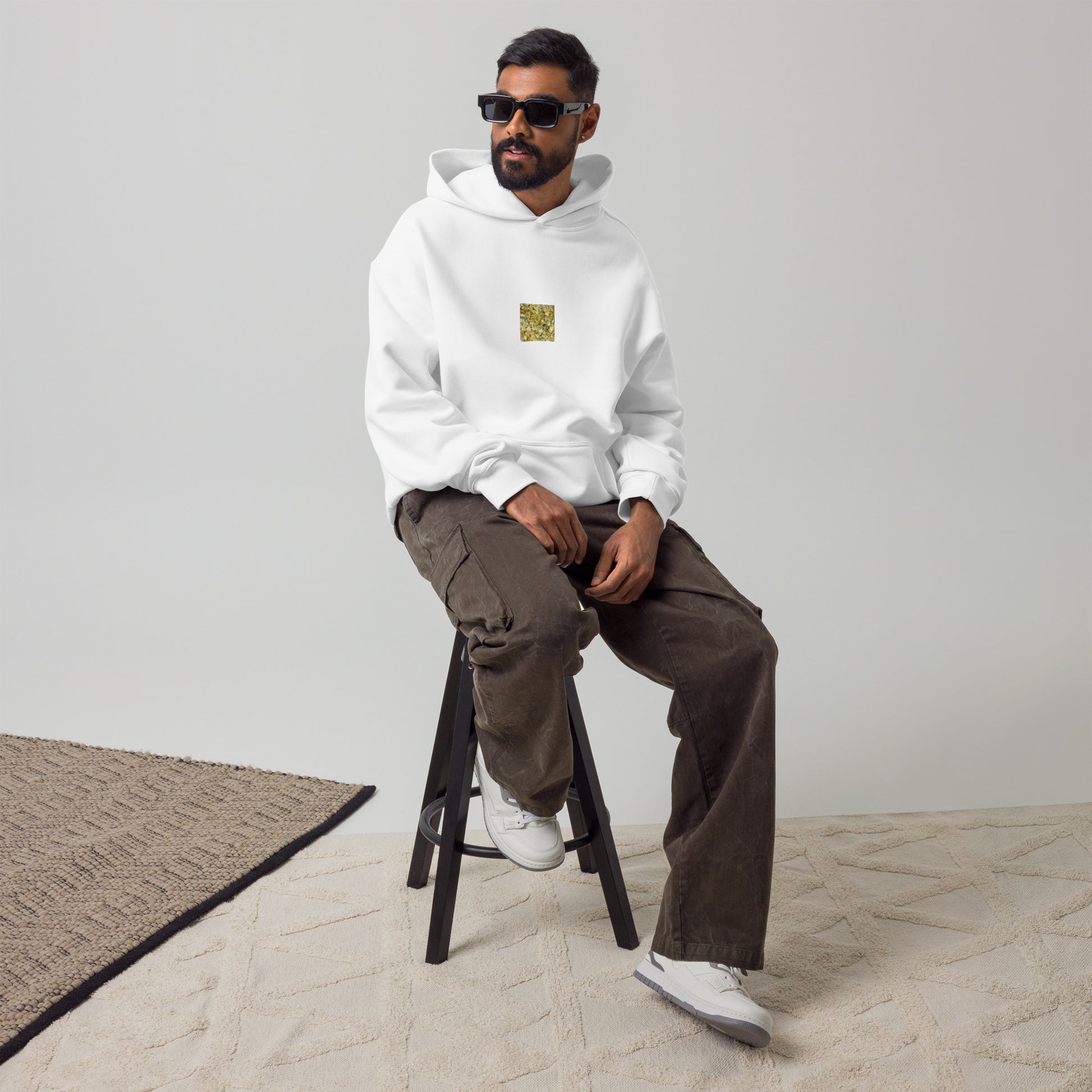 Minimalist streetwear style oversized hoodie in white featuring the 'Ginkgo Fallen Leaves' photo art on the front. / モードストリート系オーバーサイズフーディー（ホワイト）フロントに「イチョウの落ち葉」のフォトアートを配したデザイン。