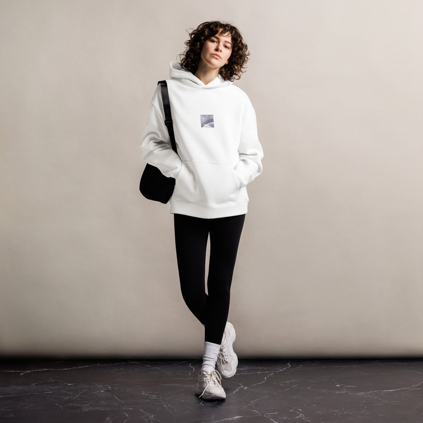Minimalist streetwear style oversized hoodie in white featuring the 'Double Rainbow (B&W)' photo art on the front. / モードストリート系オーバーサイズフーディー（ホワイト）フロントに「ダブルレインボー (モノクロ)」のフォトアートを配したデザイン。