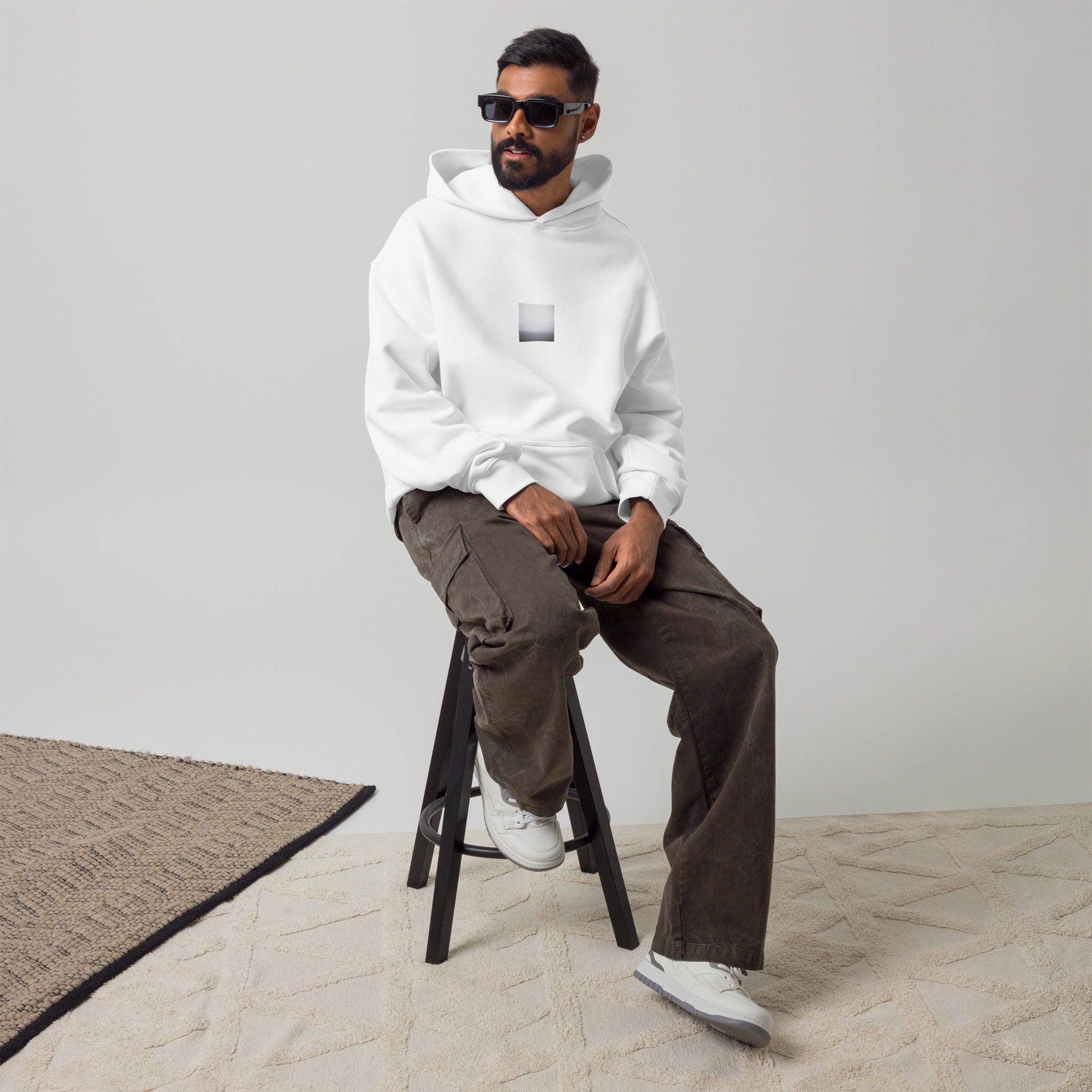Minimalist streetwear style oversized hoodie in white featuring the 'Ocean Horizon (B&W)' photo art on the front. / モードストリート系オーバーサイズフーディー（ホワイト）フロントに「オーシャンホライズン (モノクロ)」のフォトアートを配したデザイン。